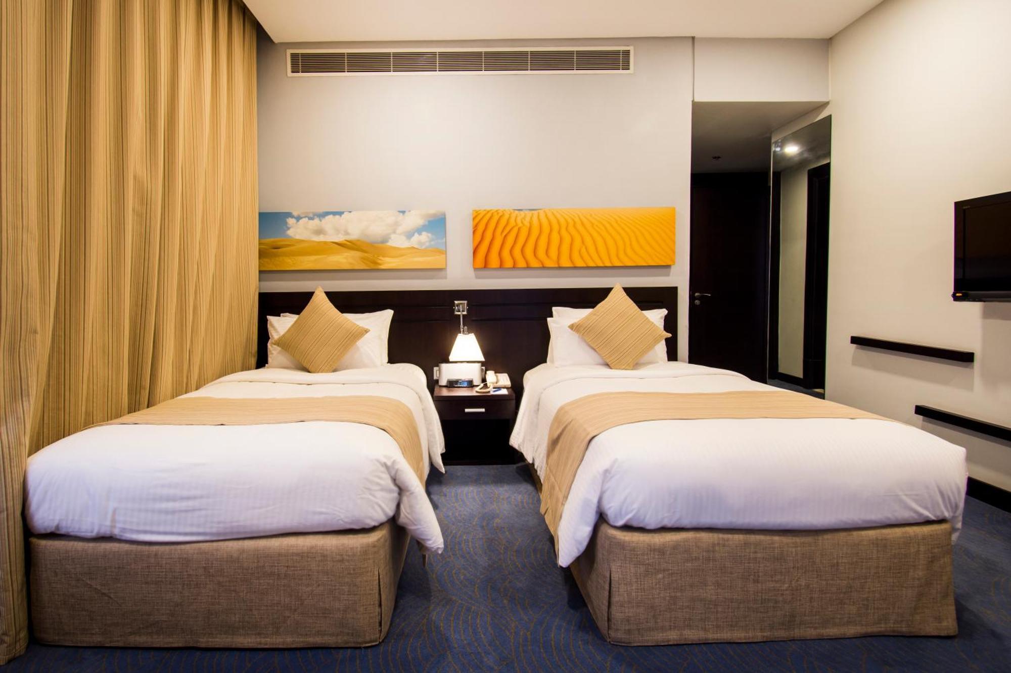 City Seasons Hotel & Suites Mascate Habitación foto