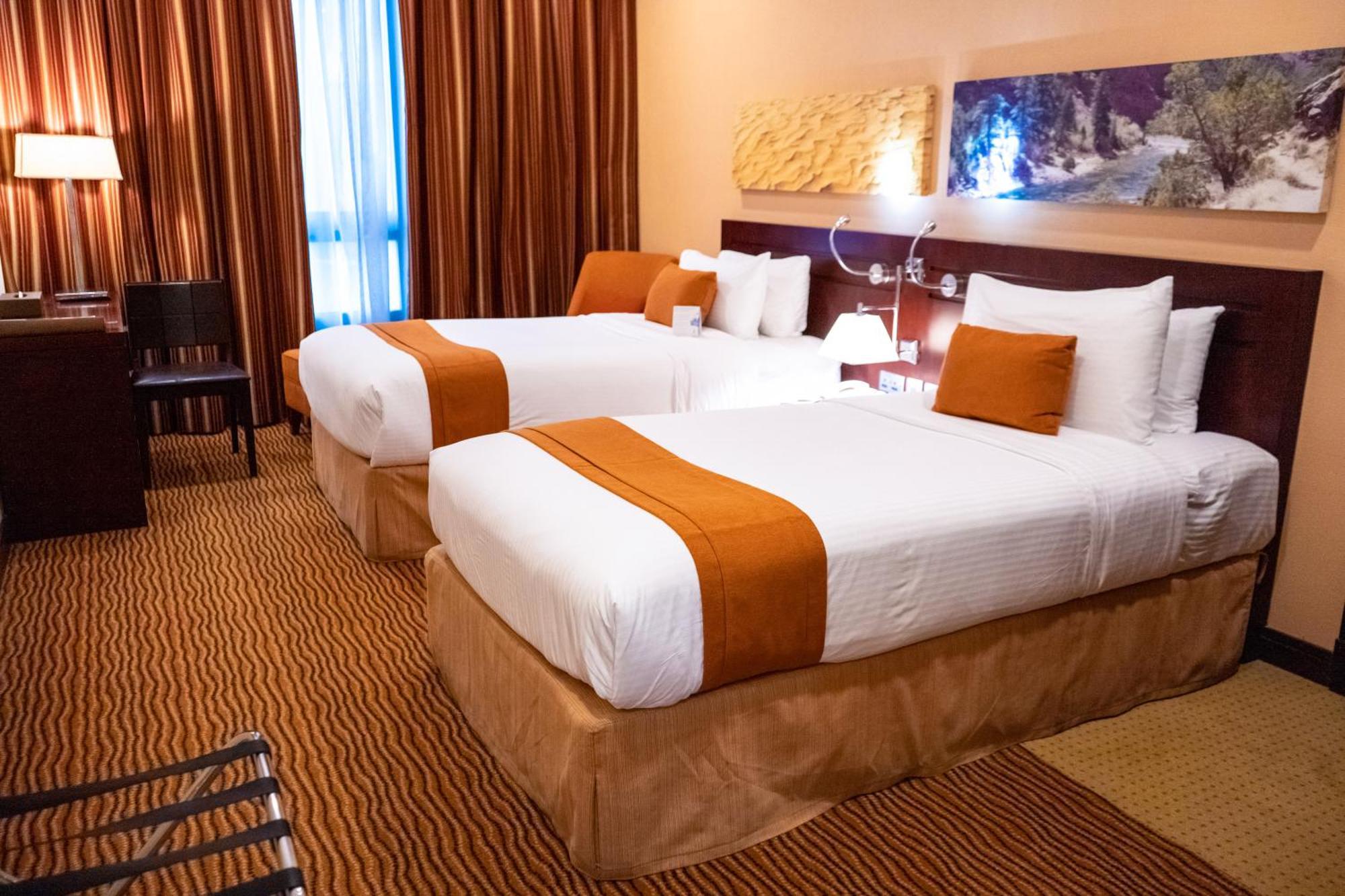 City Seasons Hotel & Suites Mascate Habitación foto