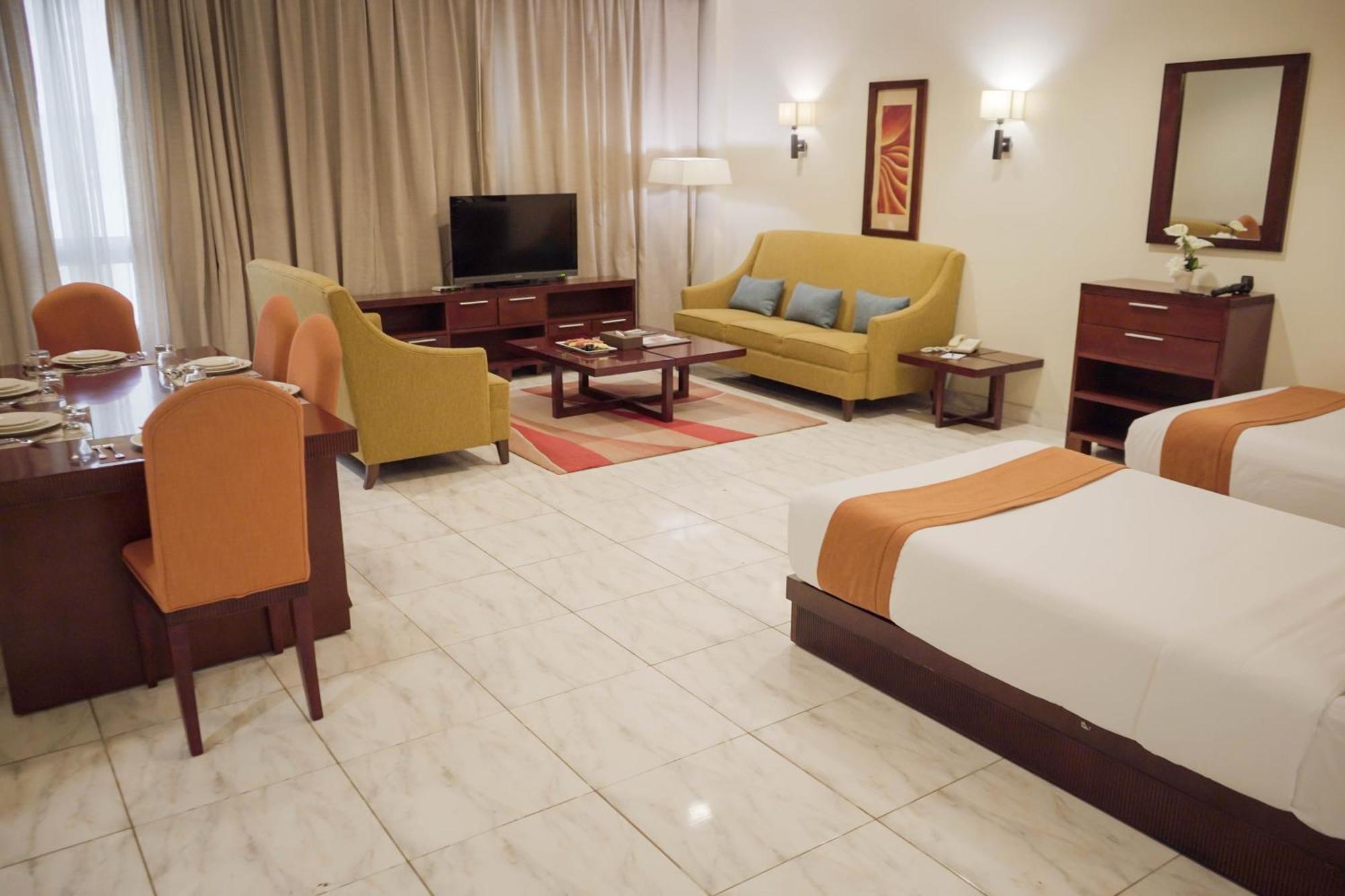 City Seasons Hotel & Suites Mascate Habitación foto